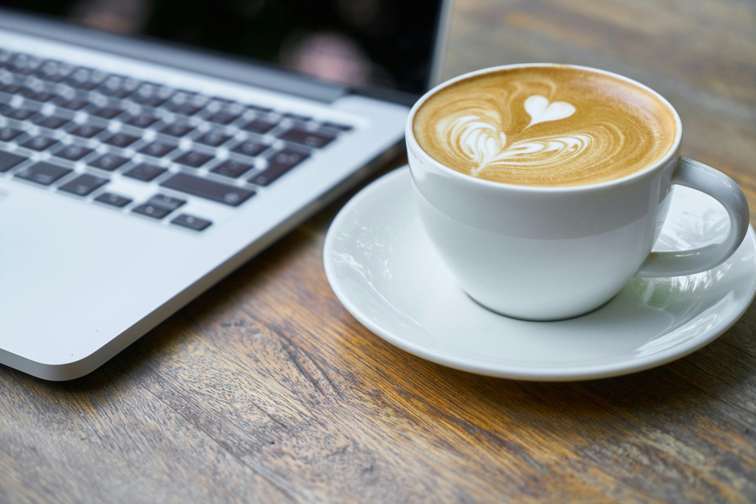 Image of a coffee cup and a computer